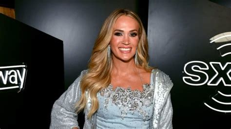 Carrie Underwood turns heads in plunging see